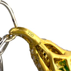 Gold bracelet link marked 750 with inset green stone on a silver chain