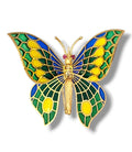 Enamel butterfly brooch with gold-tone body, blue and green wings, yellow accents, red stones