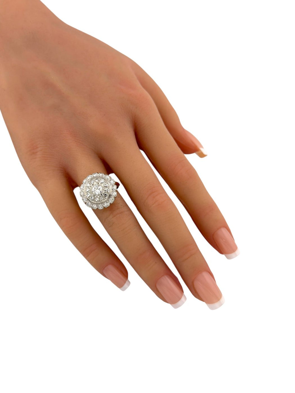 Double halo diamond ring on finger, 14K yellow gold band with round center sparkle