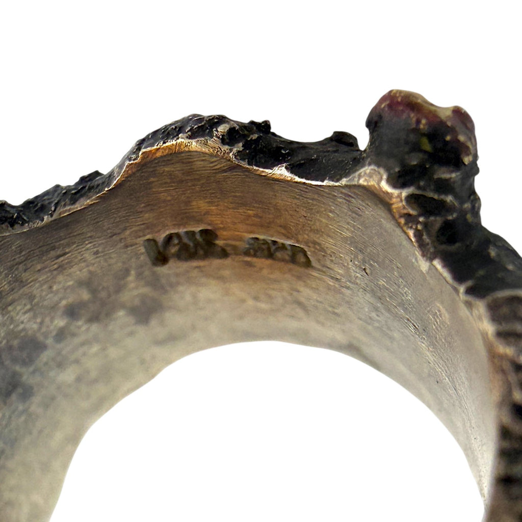 Close-up of the ring band underside with stamped metal markings