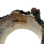 Close-up of the ring band underside with stamped metal markings
