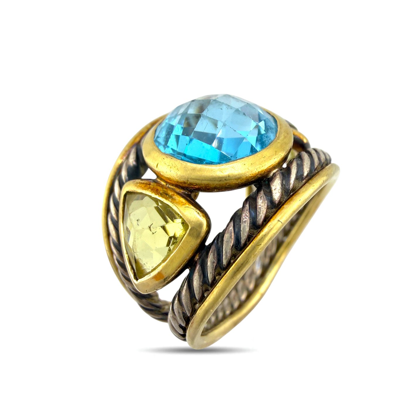 Oval blue topaz ring with yellow side stones and braided silver rope-like detailing