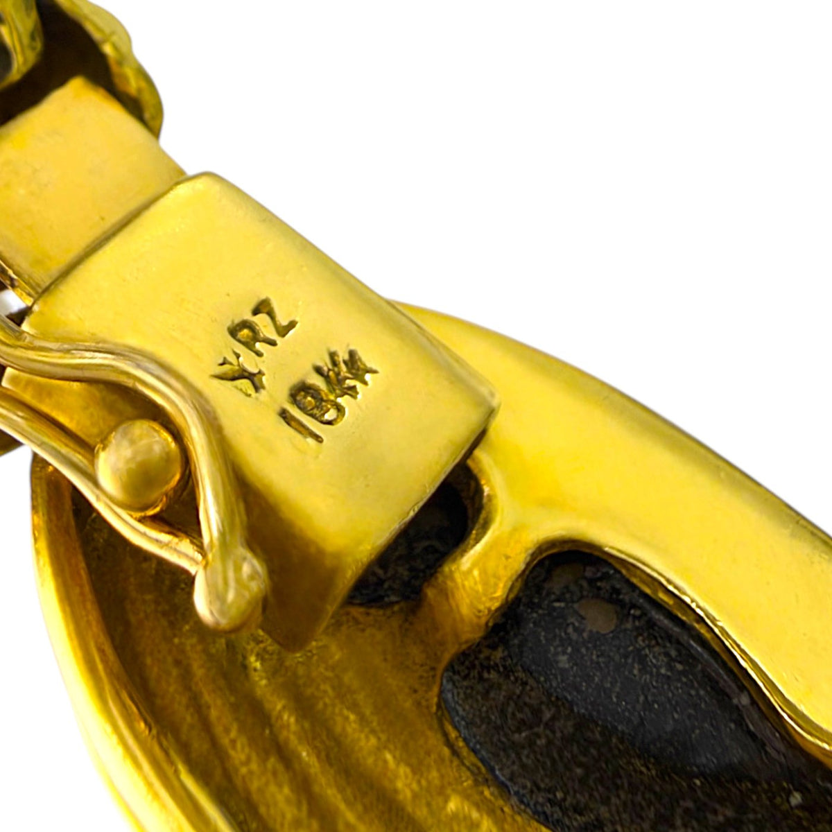 Close-up of the bracelet clasp stamped 18K gold