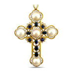 Gold cross pendant front view with large pearl, dark blue sapphires, and diamond halo