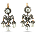 Gold-tone chandelier earrings with round bezel stones and dangling white pearls