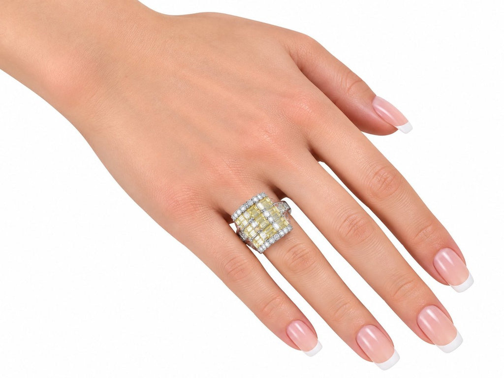 Platinum diamond ring on hand, square cluster of yellow baguette and clear round stones