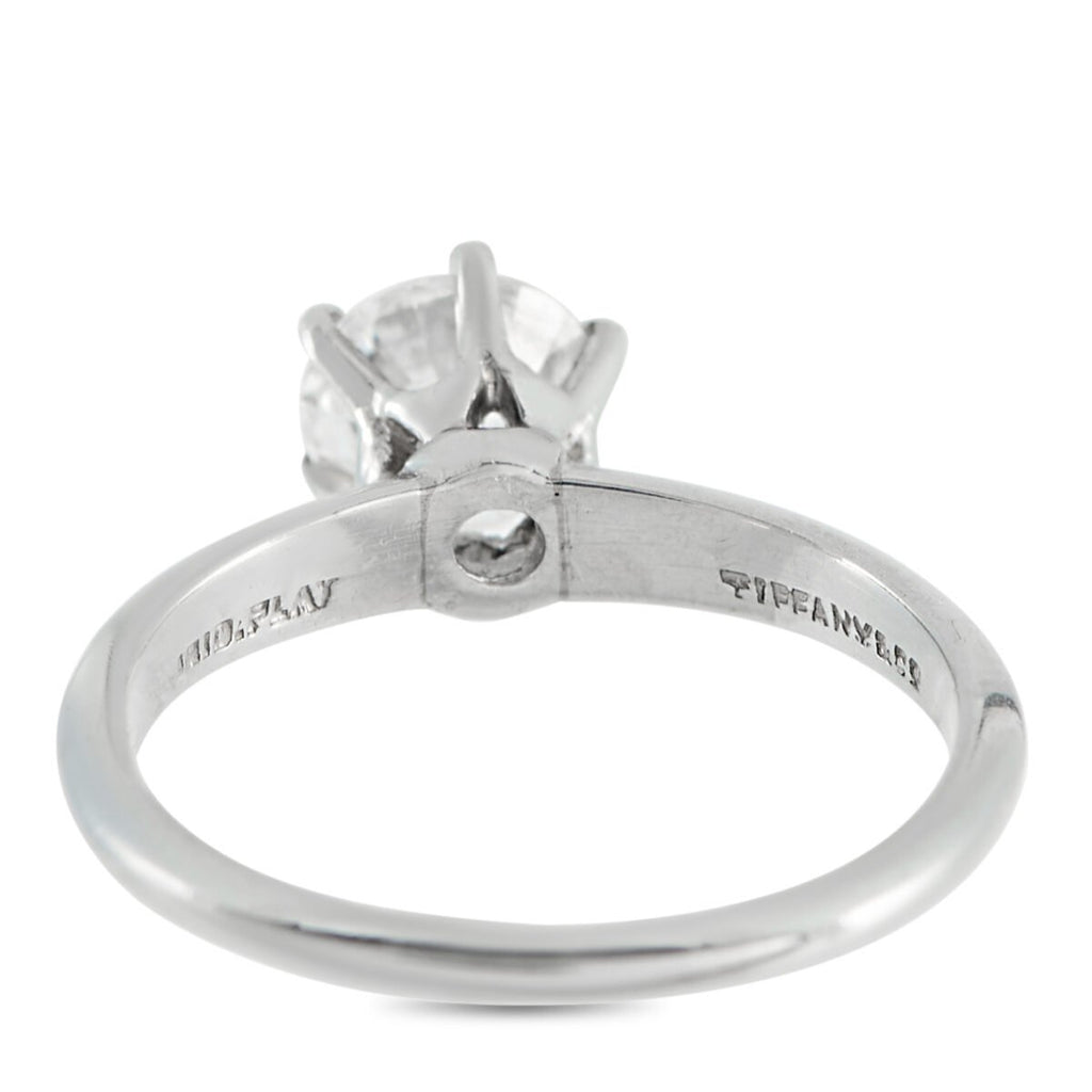 Platinum diamond solitaire ring side view with Tiffany & Co. engraving on band