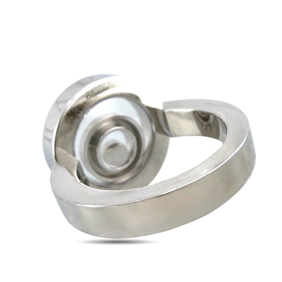 White gold floating diamond ring, side view of circular bezel and setting