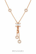 Rose gold diamond and white ceramic tassel necklace with circular charm accents