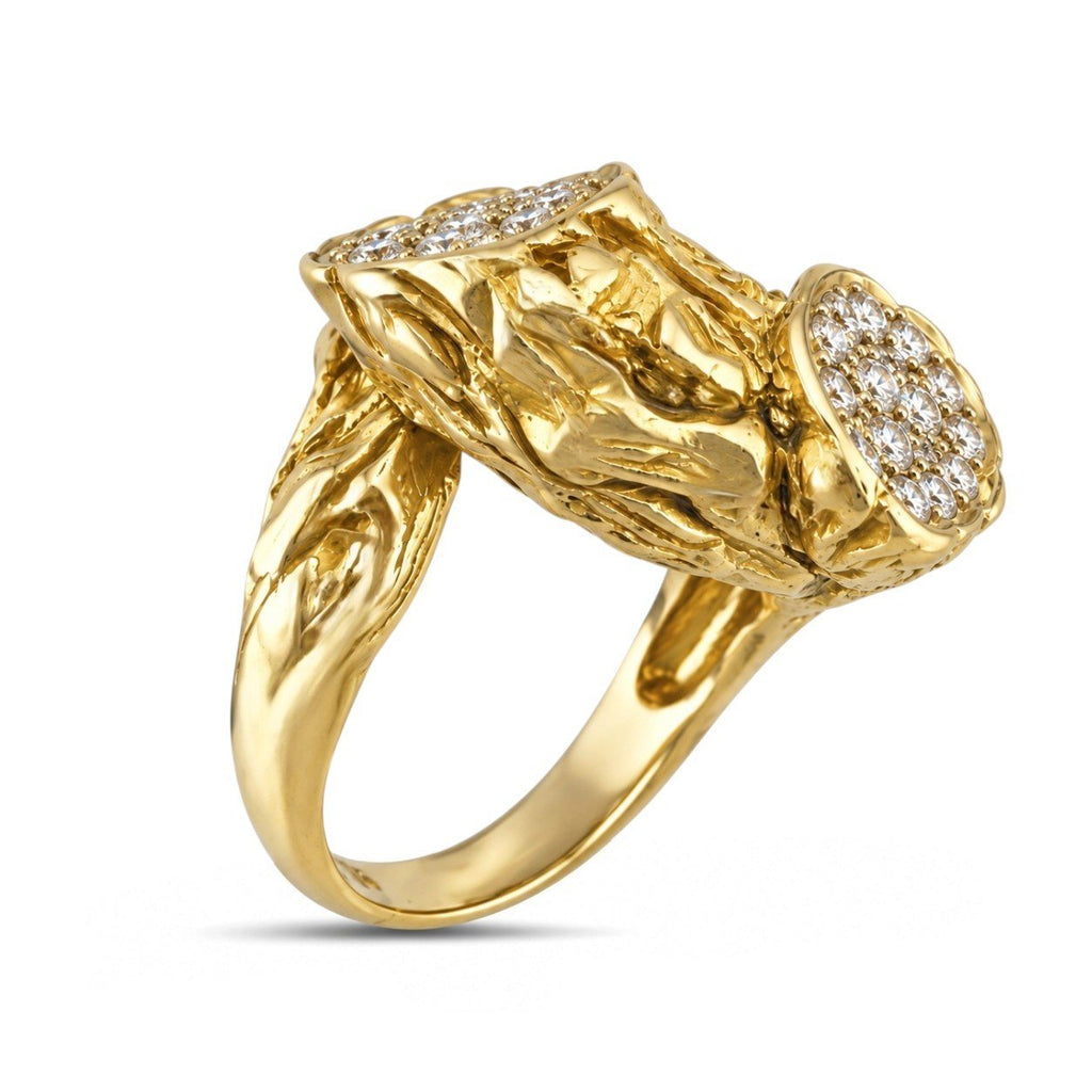 Side view of the ring's textured gold band and diamond-set branch details