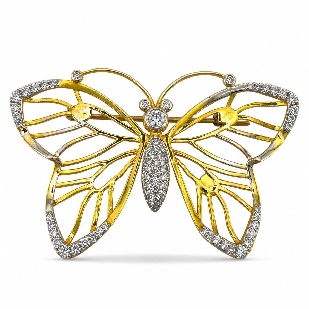 Tri-color gold butterfly brooch with openwork wings and diamond accents, viewed from the front