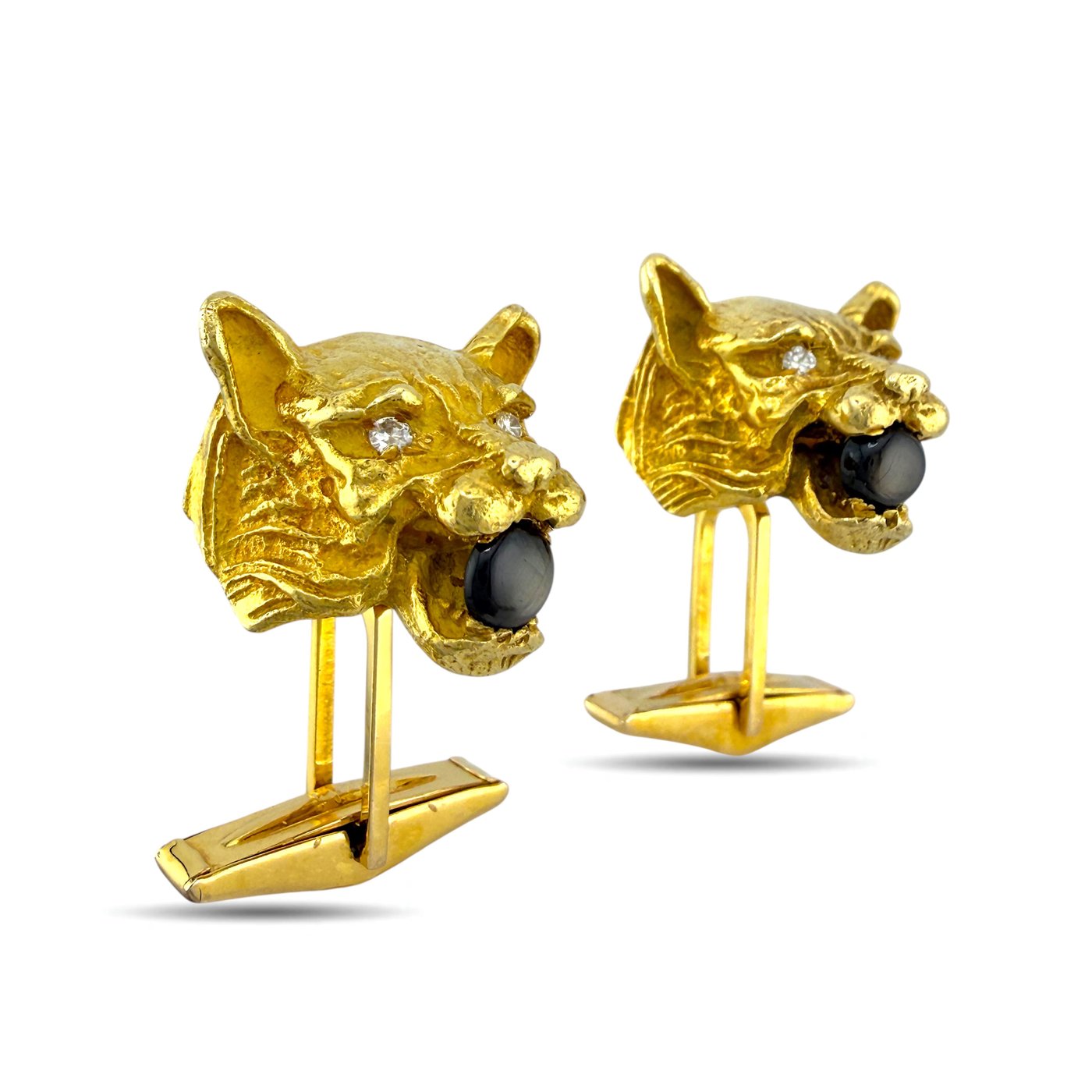 Gold panther head cufflinks with dark stone eyes and diamond accents, two-cuff pair angle