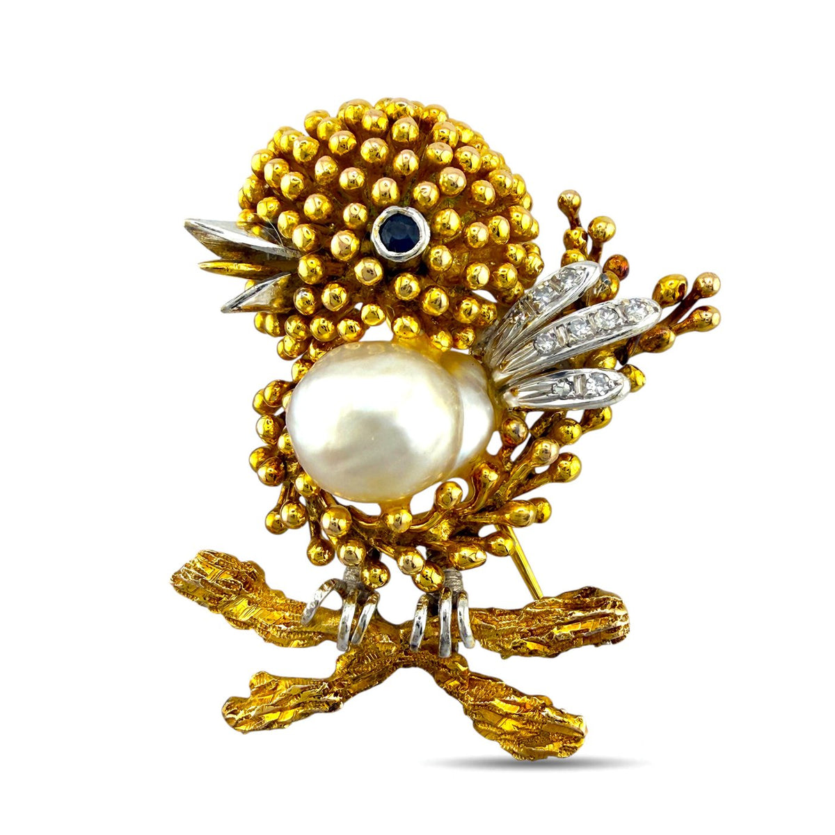 Bird brooch with round pearl centerpiece, blue sapphire cabochon eye, diamond wing details