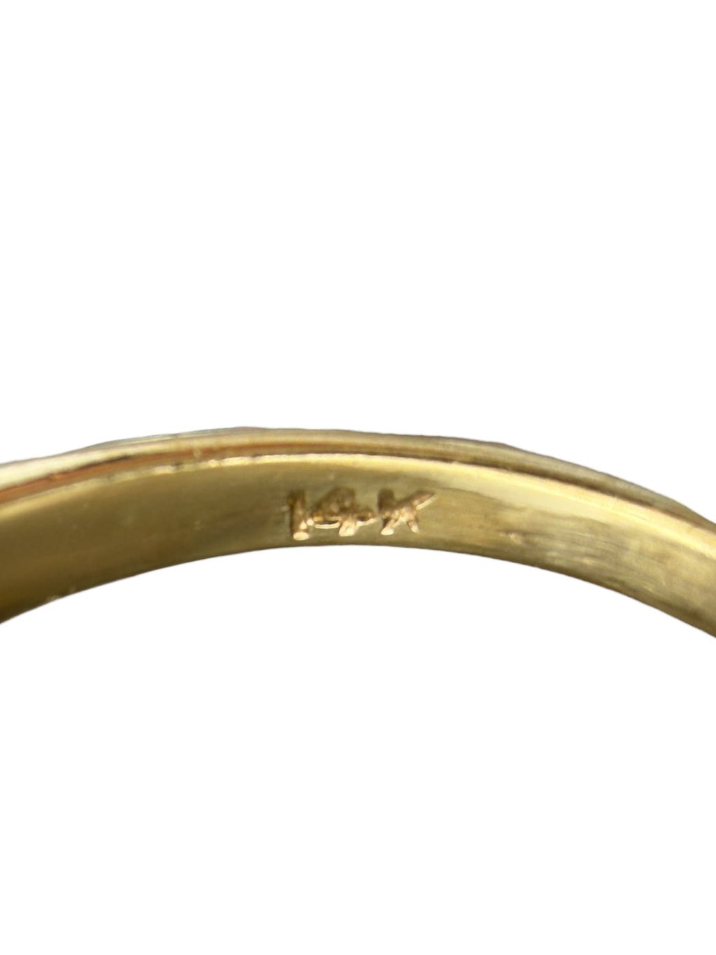 14K yellow gold ring band close-up with interior hallmark marking