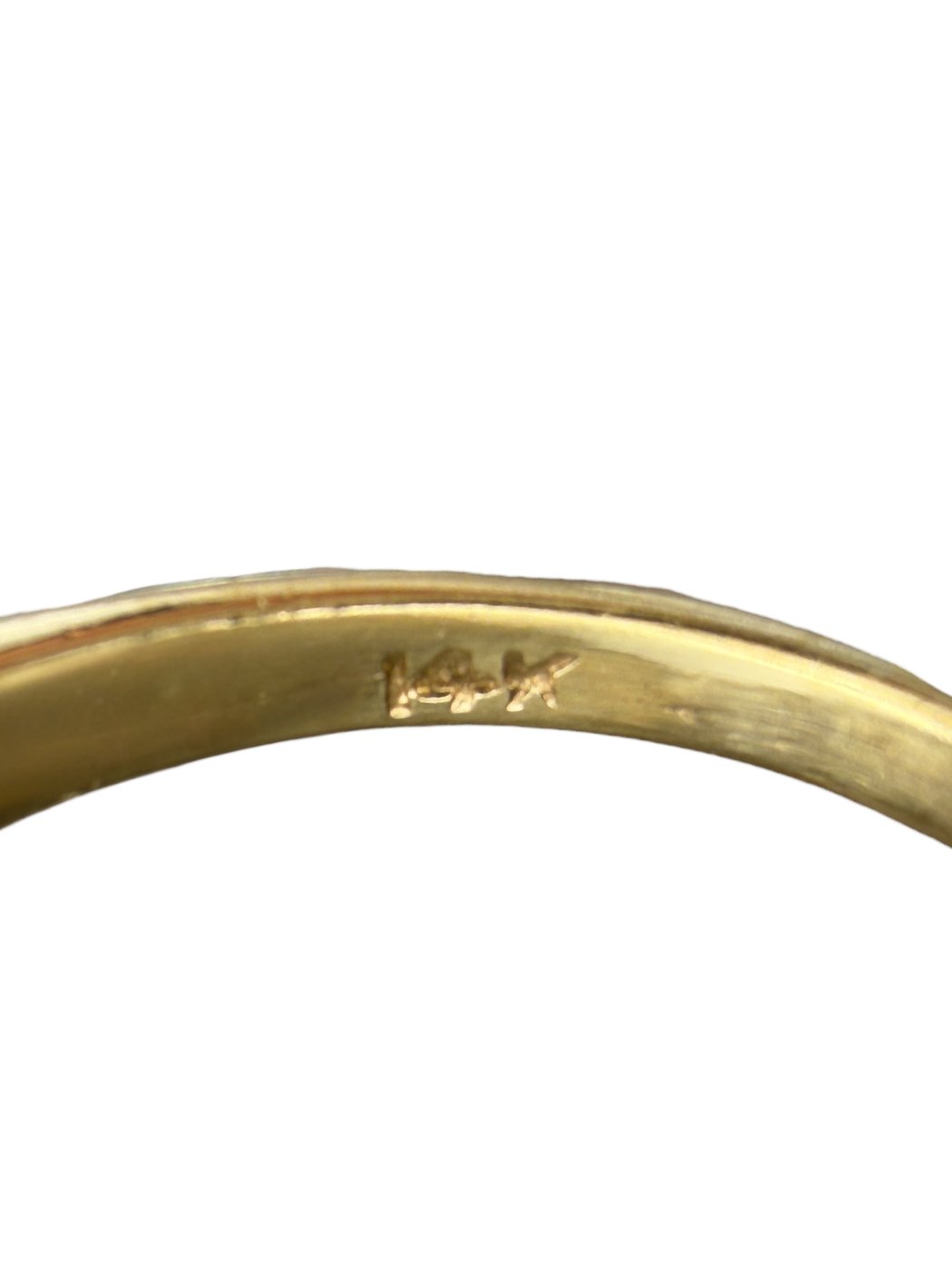 14K yellow gold ring band close-up with interior hallmark marking