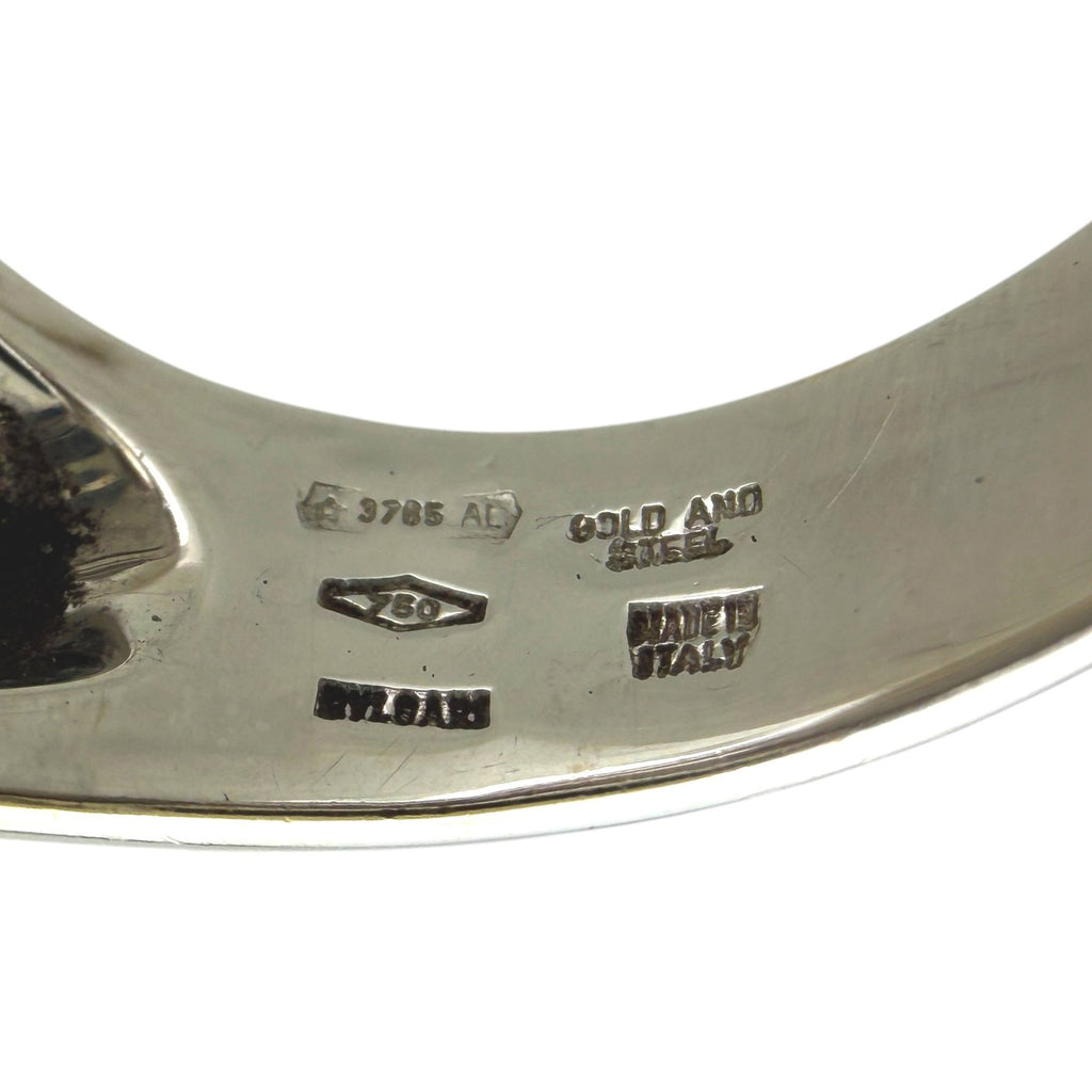 Engraved ring interior with 18k and metal trademark stamps