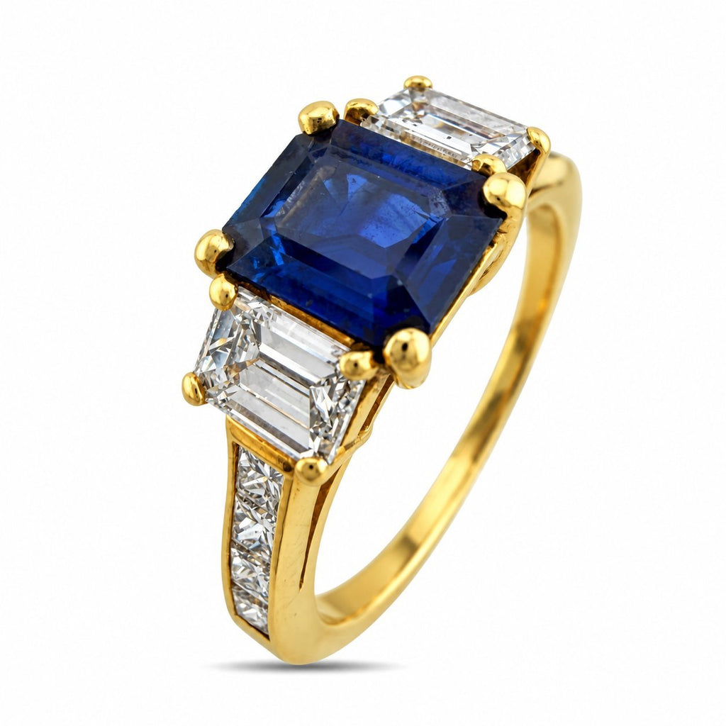 Front view 18K yellow gold ring with blue sapphire center and diamond side stones