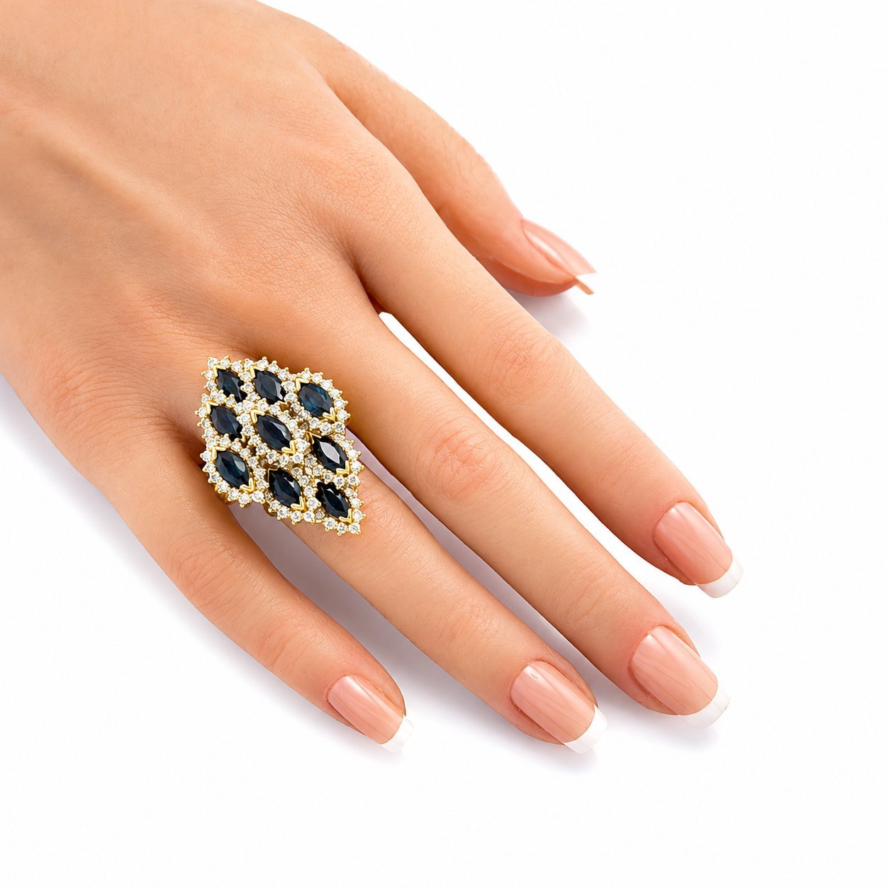 18K yellow gold cocktail ring on hand, oval blue sapphire cluster with diamond halo