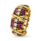 Gold ruby and diamond ring with oval cluster motif, angled view