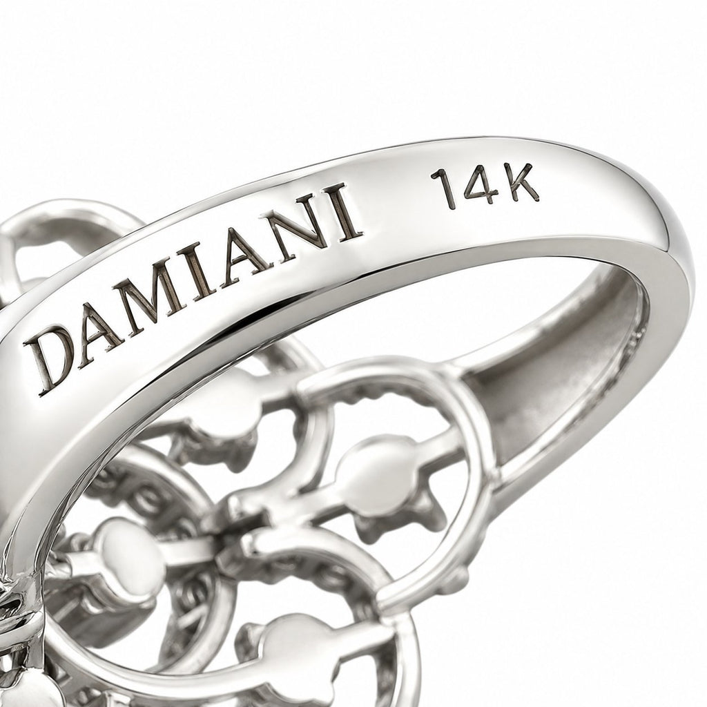 14K Damiani white gold band close-up showing “DAMIANI” and “14K”