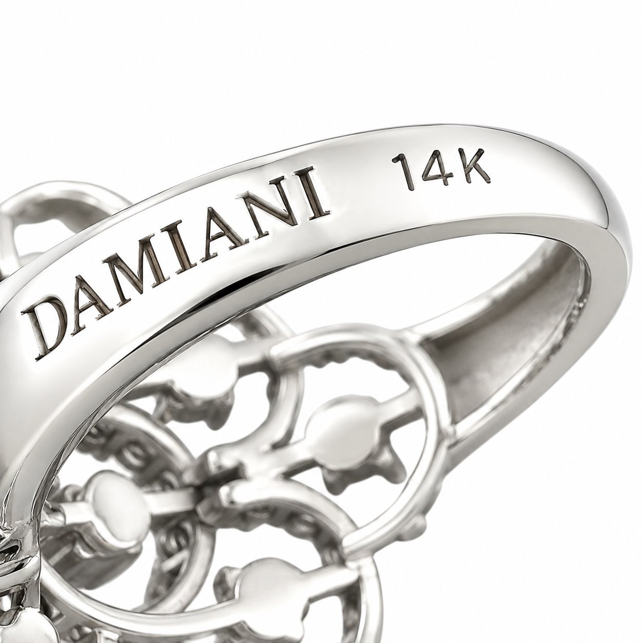 14K Damiani white gold band close-up showing “DAMIANI” and “14K”