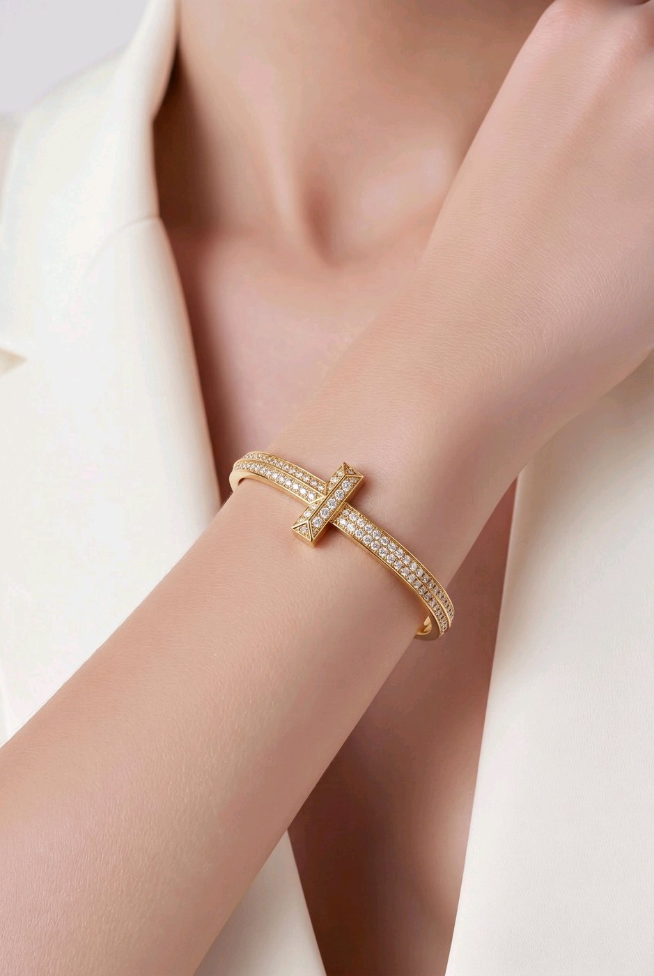 Tiffany & Co. 18K yellow gold T1 wide diamond hinged bracelet on wrist