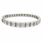 18K white gold tennis bracelet with a row of round diamonds in settings