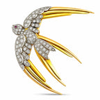 18K yellow and rose gold bird brooch with diamonds and ruby eye