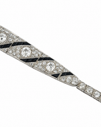 Art Deco 18K white gold diamond bracelet with black enamel geometric panels