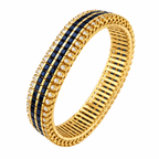 Gold cuff bracelet with blue sapphire checker pattern and diamond accents along the edges.
