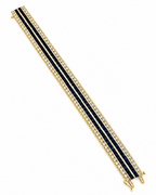 Yellow gold tennis bracelet with blue sapphire stripes and diamond line stones, open end.