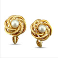 Knot-style hoop earrings with white pearl centers and gold hook backs