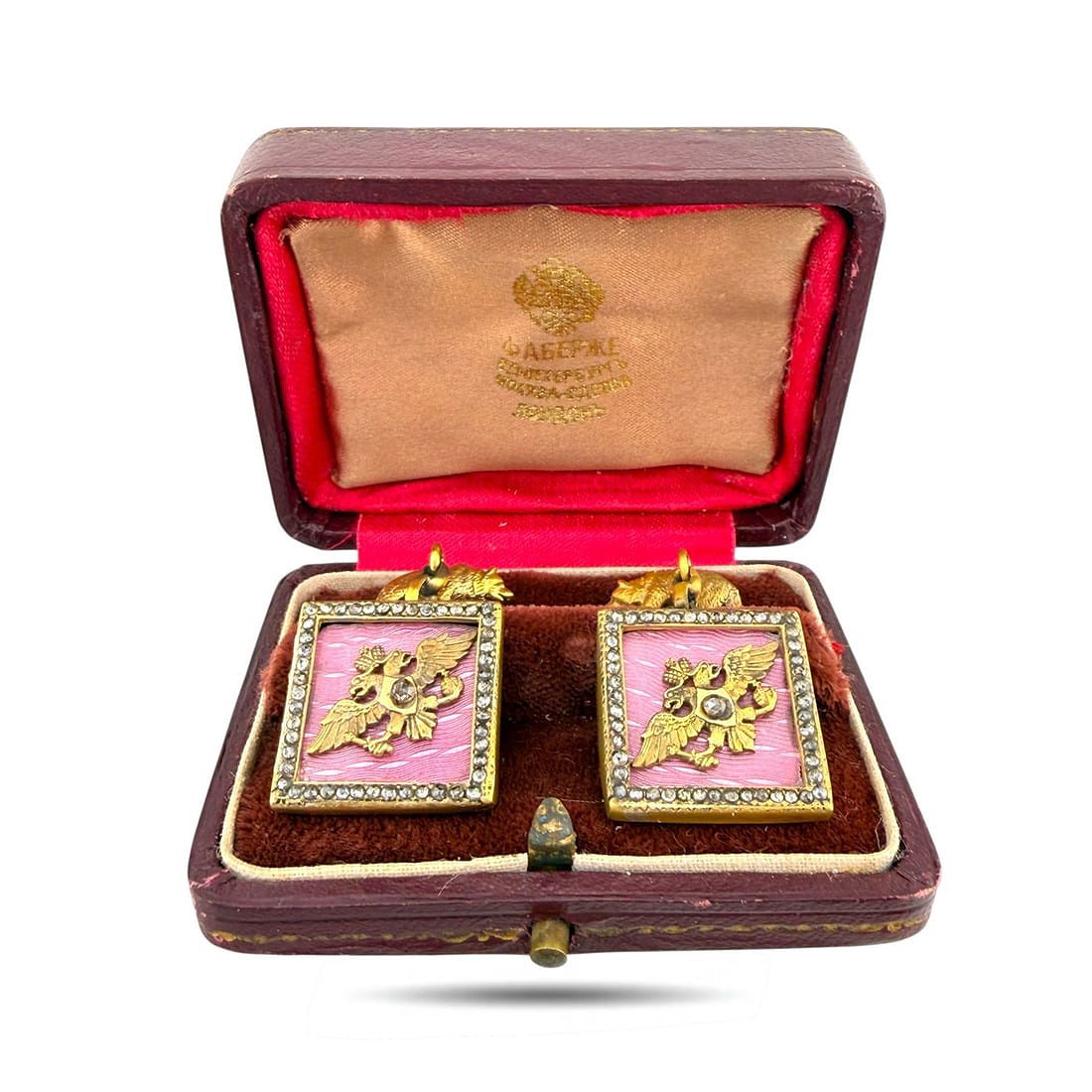 Gold-tone square enamel cufflinks with pink panels in open presentation box