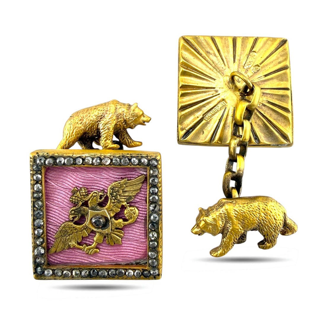 Square gold-tone pink enamel cufflinks with animal finials and chain bar details