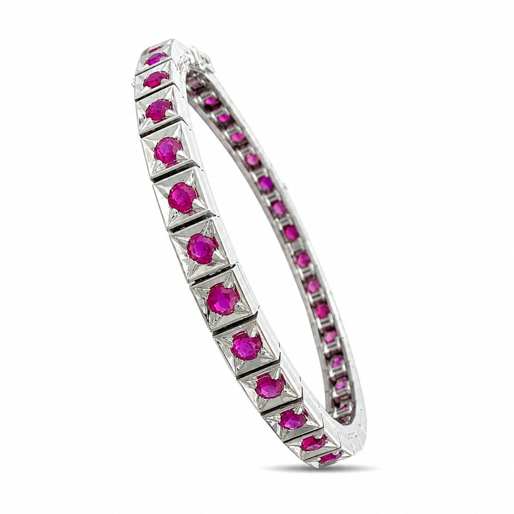 Platinum bracelet with faceted ruby stones in prong-set geometric sections