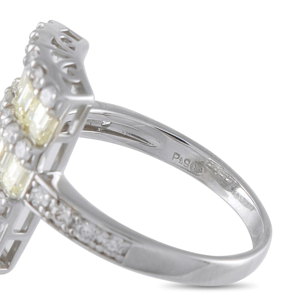 Platinum diamond ring close-up, stamped band with prong-set baguette and round stones