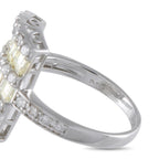 Platinum diamond ring close-up, stamped band with prong-set baguette and round stones