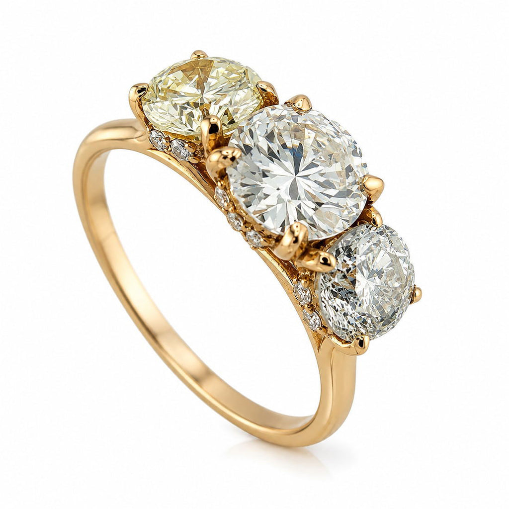 Rose gold three-stone diamond ring with three oval stones in prong settings