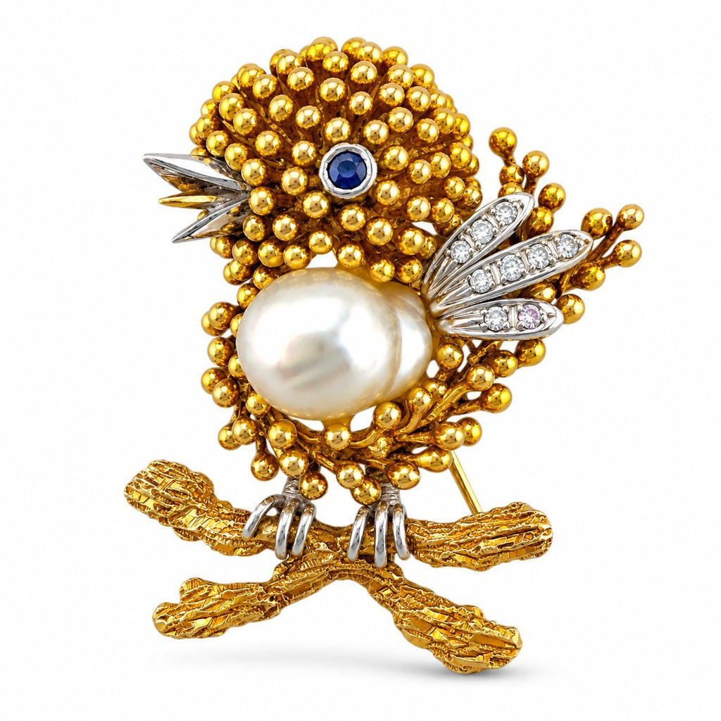 Gold-tone bird brooch with pearl center, sapphire eye, diamond accents and beaded body
