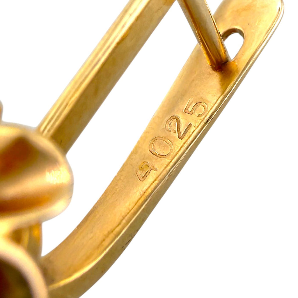 Gold-tone clip hinge stamped '4025' on the earring back
