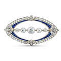 Oval Art Deco brooch in white gold with pavé diamonds and blue sapphire band