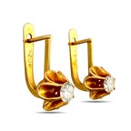 Gold-tone hinged clip earrings with round clear stones in petal settings