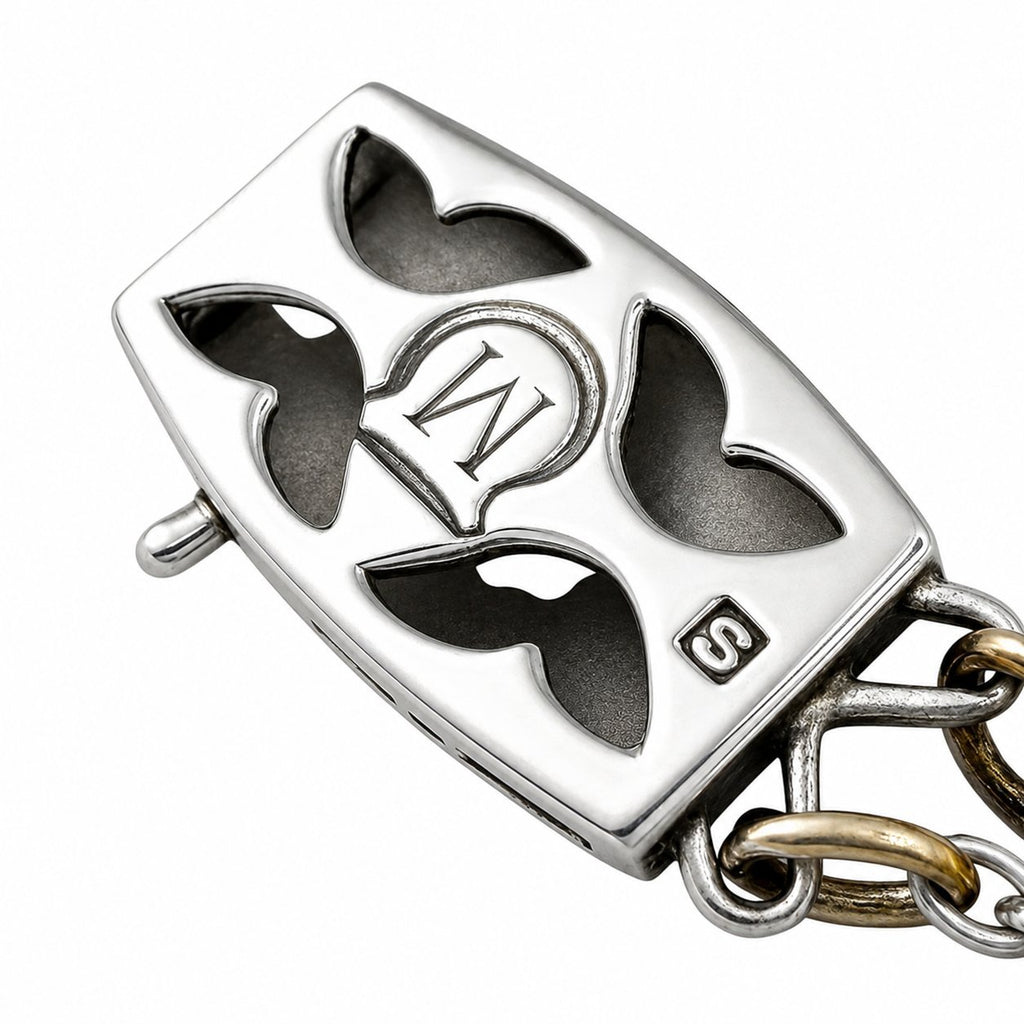 Rectangular pendant with black enamel hearts and “M” monogram in white gold