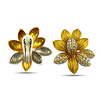 Flower earring pair showing diamond-set fronts and gold backs