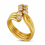 Sonia B. multi-band gold ring with a row of round diamonds, angled view