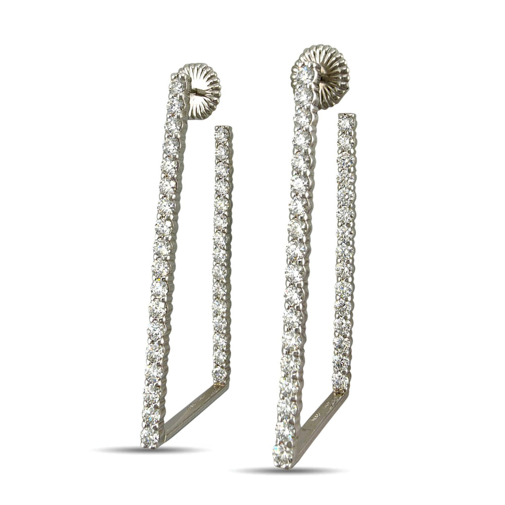 Platinum diamond drop earrings with long open rectangular frames and sculpted fan-shaped studs