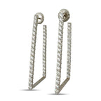 Platinum diamond drop earrings with long open rectangular frames and sculpted fan-shaped studs