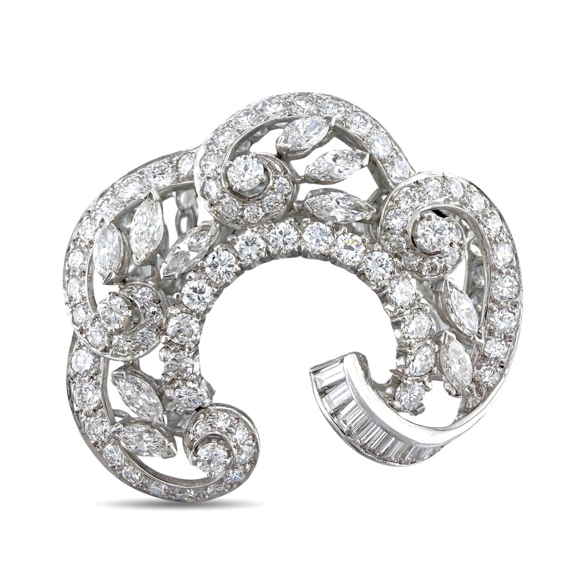 18K white gold diamond swirl brooch with baguette and round stones, open frame.