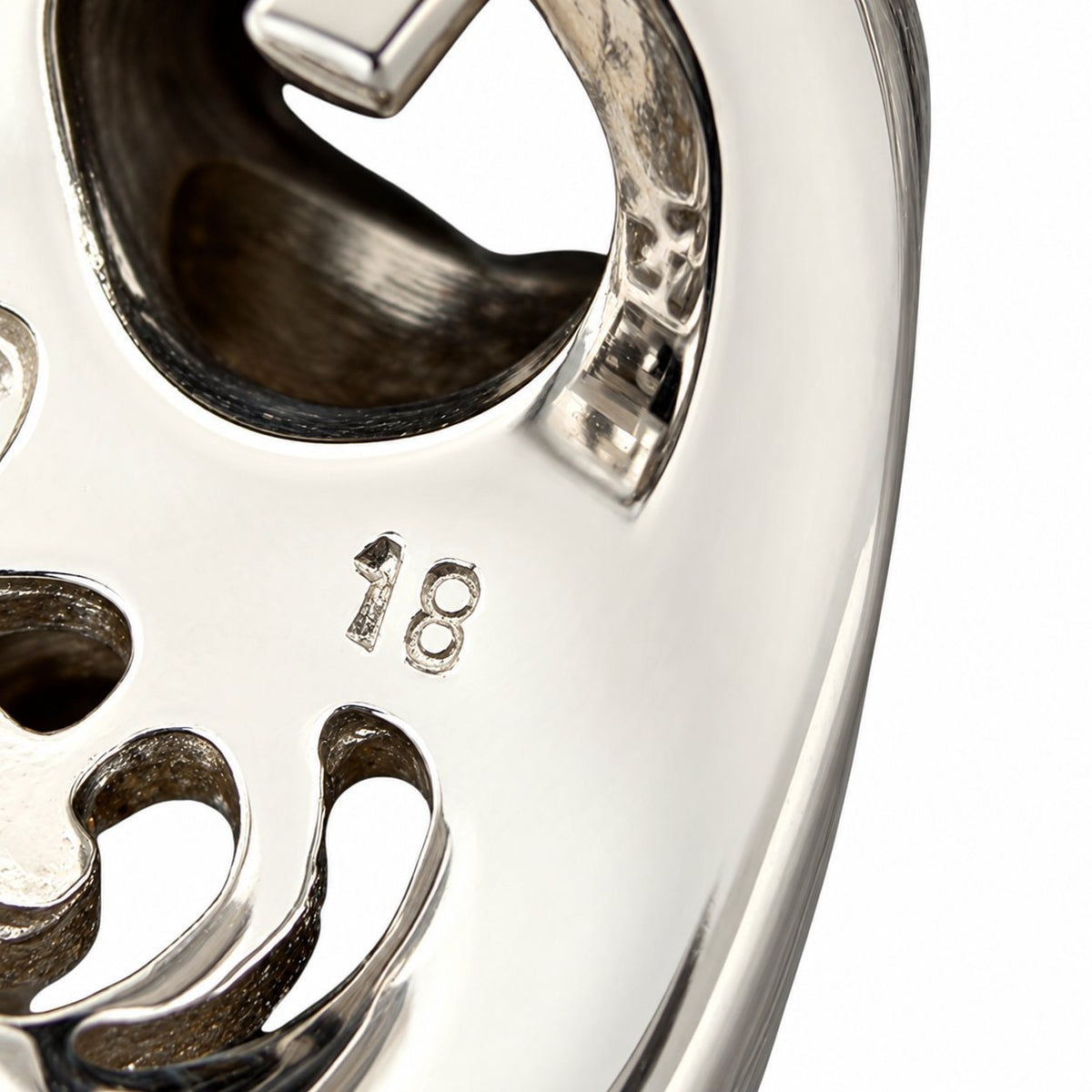 Close-up of the white gold earring back stamped 18K