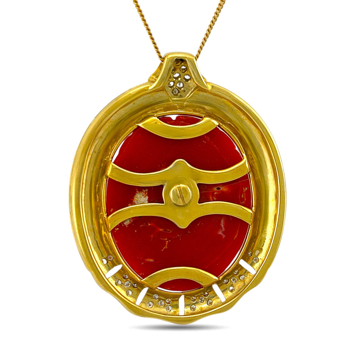 Back of coral face pendant showing gold setting and openwork